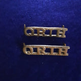Original pair of brass shoulder titles the Queen's Royal Irish Hussars (QRIH)
