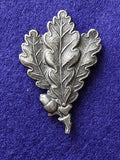 Original WW2 German Jager oakleaf insignia alloy cap badge