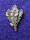 Original WW2 German Jager oakleaf insignia alloy cap badge