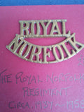 Original brass shoulder title The Royal Norfolk Regiment